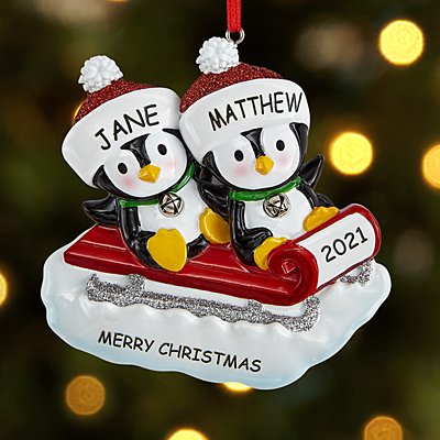 Sledding Penguin Couple Ornament